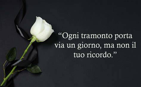 Un'immagine serena e commemorativa che rappresenti il ricordo di una persona cara, come un lume acceso o un fiore delicato.