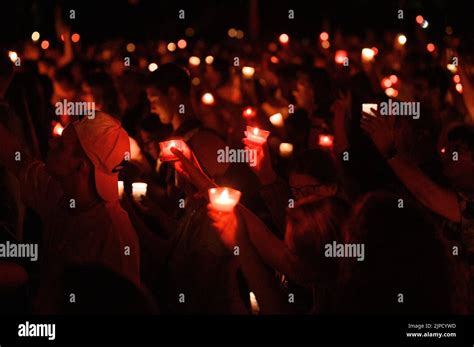 Thematic photo of people praying with candles or the