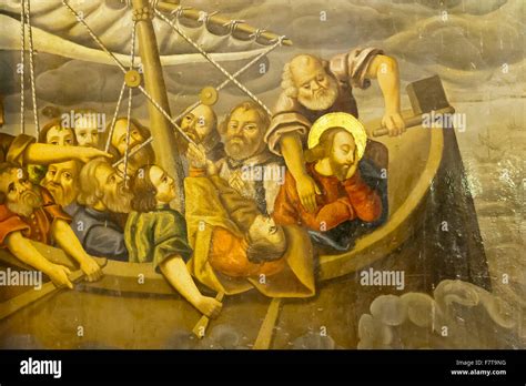 Illustrazione di Gesù che dorme sulla barca in tempesta, mentre i discepoli sono spaventati