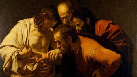 Gesù Risorto mostra le piaghe a Tommaso incredulo, un momento chiave della misericordia