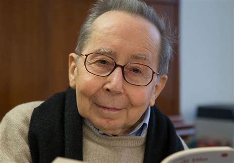 Angelo Casati in veste di sacerdote, intento a scrivere o leggere