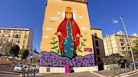 Murales raffigurante don Franco Sudati e personaggi di Pao con ragazzi