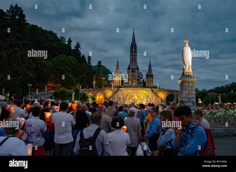 Pilgrims in procession at Lourdes, showing solidarity