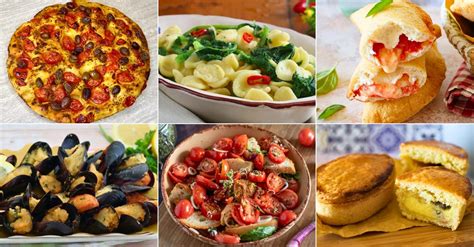 Tavolo imbandito con piatti tipici pugliesi e pizza al Ristorante Bar I Santi
