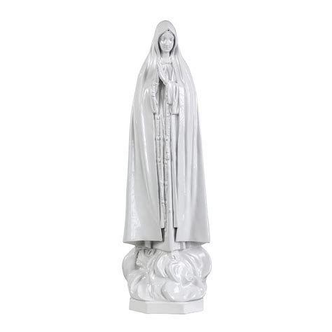Foto di una statua della Madonna di Fatima in polvere di marmo bianca in una nicchia