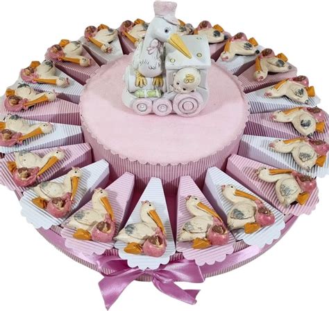 Torta bomboniera a tema unicorno con salvadanaio centrale e fette decorate con magneti