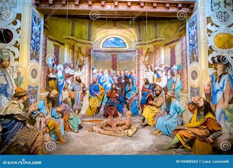 Rappresentazione di un santo medievale che compie un miracolo (es. guarisce malati, calma animali)