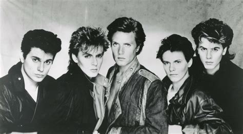 Foto storica dei Duran Duran con Andy Taylor durante un concerto negli anni '80