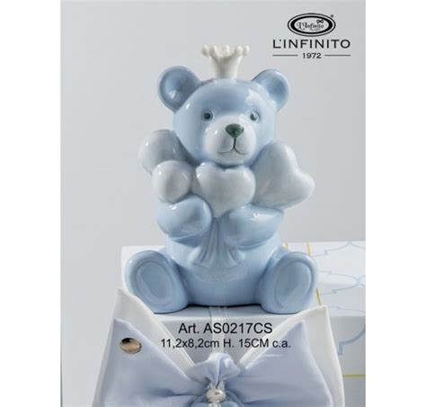 Scultura orsetto celeste con corona e palloncini a cuore bianchi