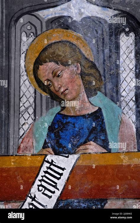 Rappresentazione artistica dell'evangelista Giovanni che scrive il suo Vangelo
