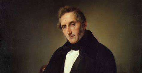 Alessandro Manzoni seduto al suo scrittoio, intento a scrivere