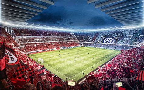 Campo da calcio con stadio Varese in sfondo, magari con tifosi