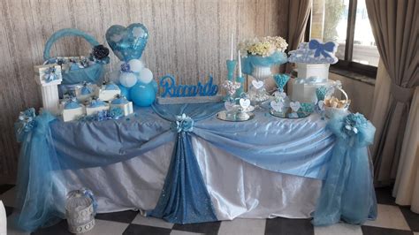 tavolo buffet battesimo con decorazioni pastello e piccoli giocattoli