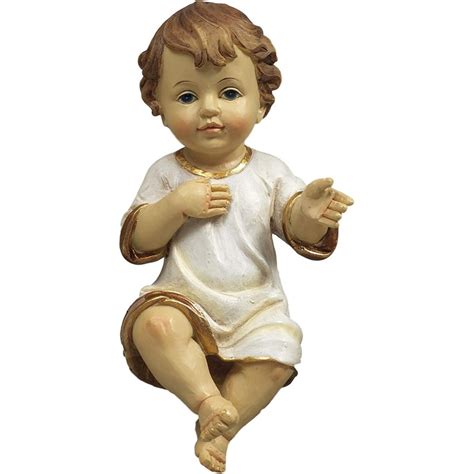 Foto di una statua moderna del Bambino Gesù con occhi in vetro per presepe