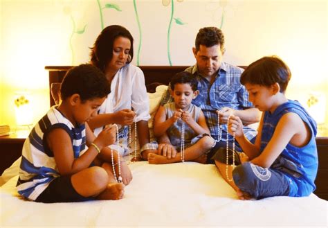 Illustration of a family praying together with a rosary, depicting various mysteries of the rosary