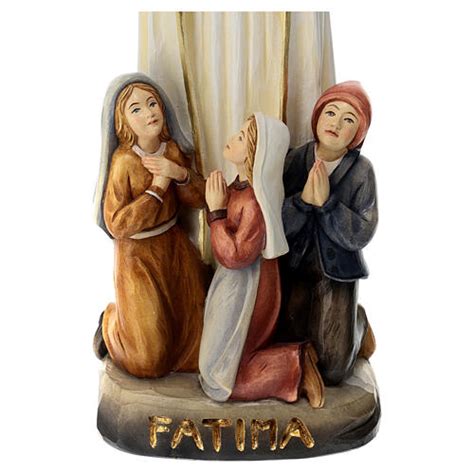 illustrazione dei tre pastorelli di Fatima inginocchiati davanti alla Madonna