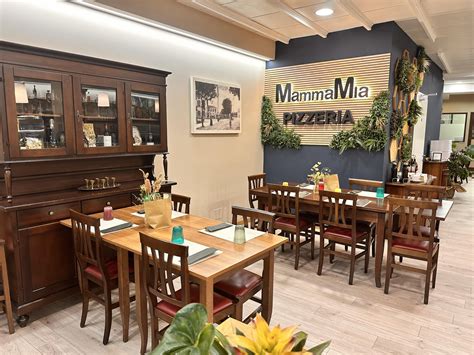 Foto tematica di un ambiente ristorante o pizzeria che evidenzia l'ospitalità e il cibo