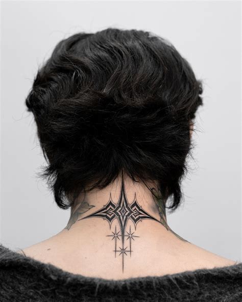 Photo of Fedez's neck tattoos: spiderweb and shark