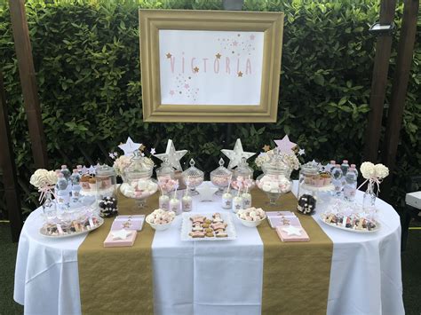 Esempio di tavola battesimo allestita con colori rosa e oro